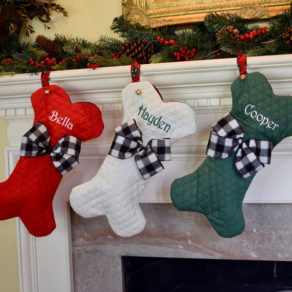 three spoiled dogs embroidered christmas stockings in the shape of a dog bone with custom bows