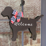 three spoiled dogs customizable labrador retriever welcome door hanger with a stars and stripes bow on a wreath hanging on a front door