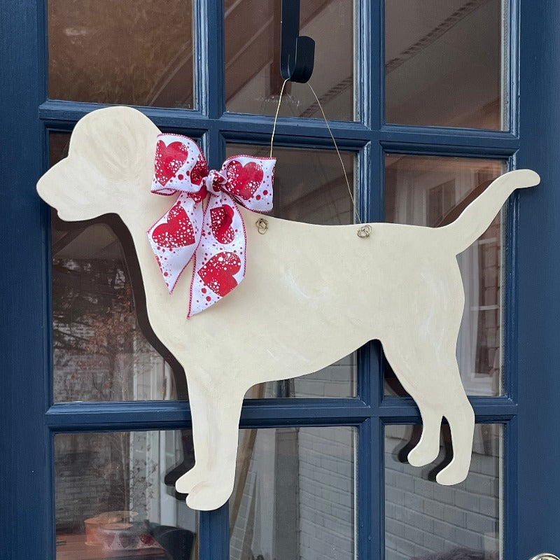 three spoiled dogs customizable labrador retriever welcome door hanger with a valentine bow hanging on a front door