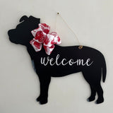 three spoiled dogs customizable pitbull welcome door hanger with a heart bow hanging on a front door
