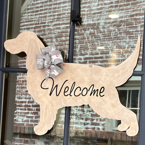 three spoiled dogs customizable english setter welcome door hanger with a gray bow with easter bunnies hanging on a front door
